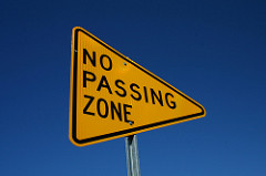 Identify the shape below that is the shape of a No Passing Zone sign.