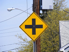 Identify the sign shown below  A. Crosswalk Ahead  B. Intersection Sign  C. Church Crossing Sign