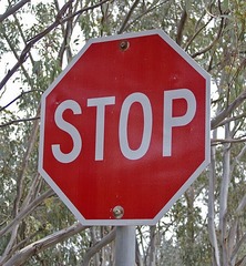 Slow down and come to a complete stop