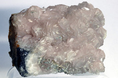 Dolomite: NM; 2.9 Hardness; no cleavage; opaque off-white; white streak; sandy; effervesces when powdered; Chemical Formula CaMg(CO3)2